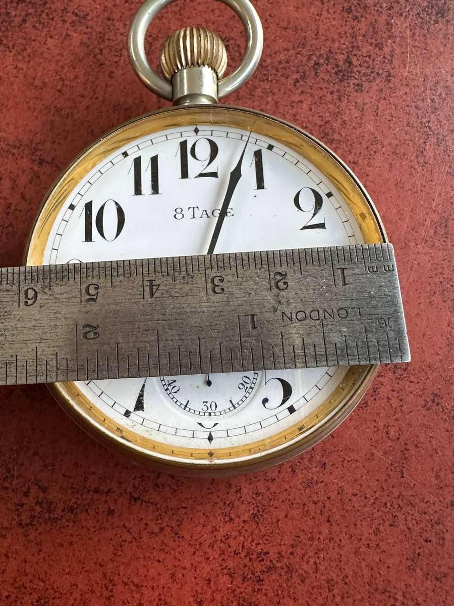 A Brevet 8 Day Goliath pocket watch in .800 silver stand