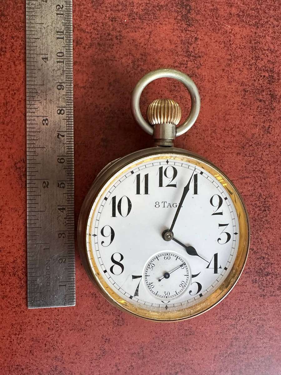 A Brevet 8 Day Goliath pocket watch in .800 silver stand