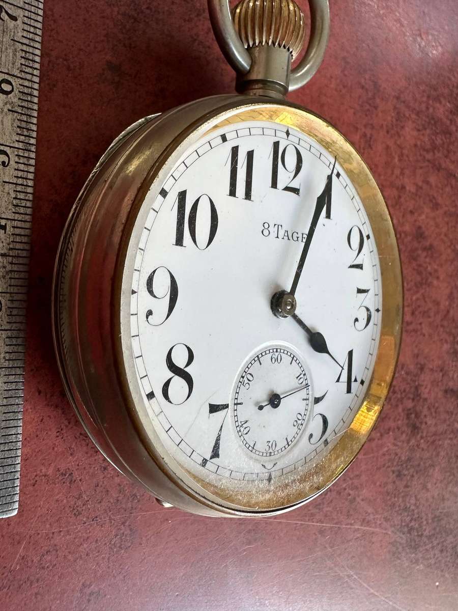 A Brevet 8 Day Goliath pocket watch in .800 silver stand