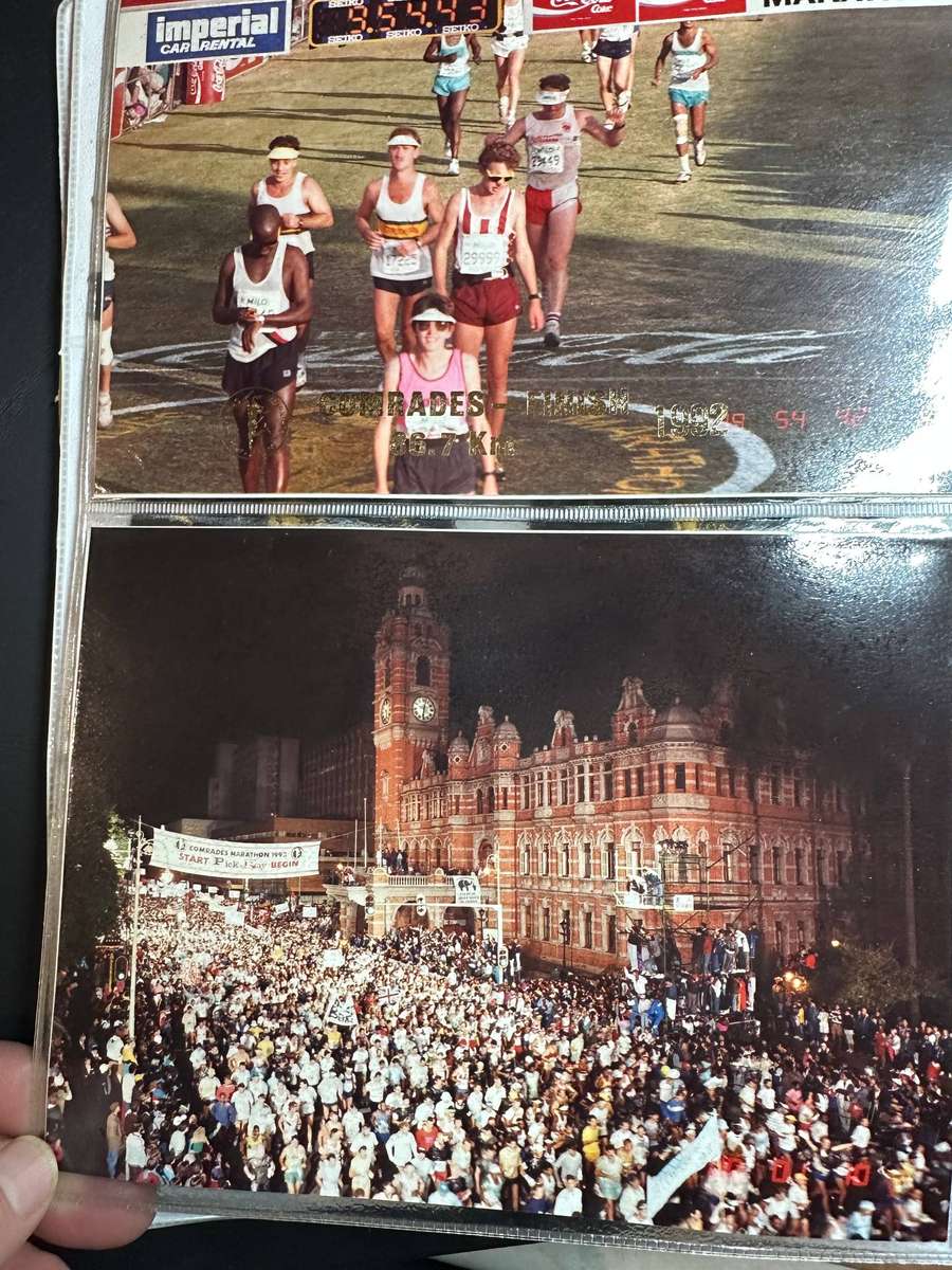 Comrades Marathon Folder with 11 medals, cloth badges etc.