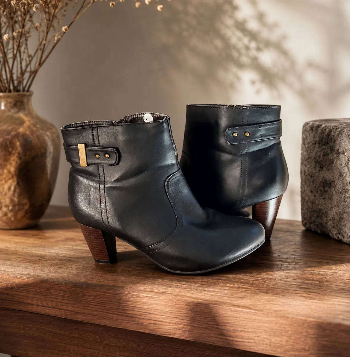 Brown ankle heel boots in size 7.