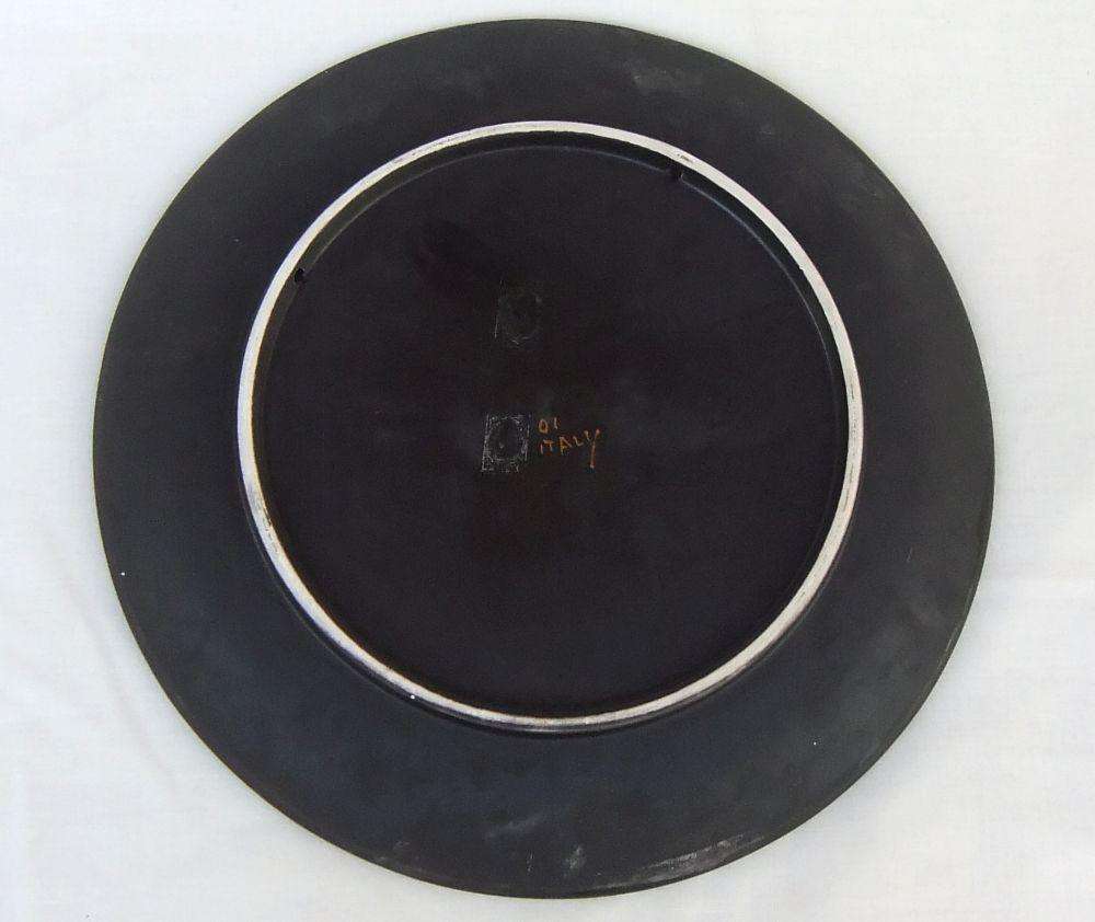 A rare mid-century signed Italian pottery wall charger with intricate detail
