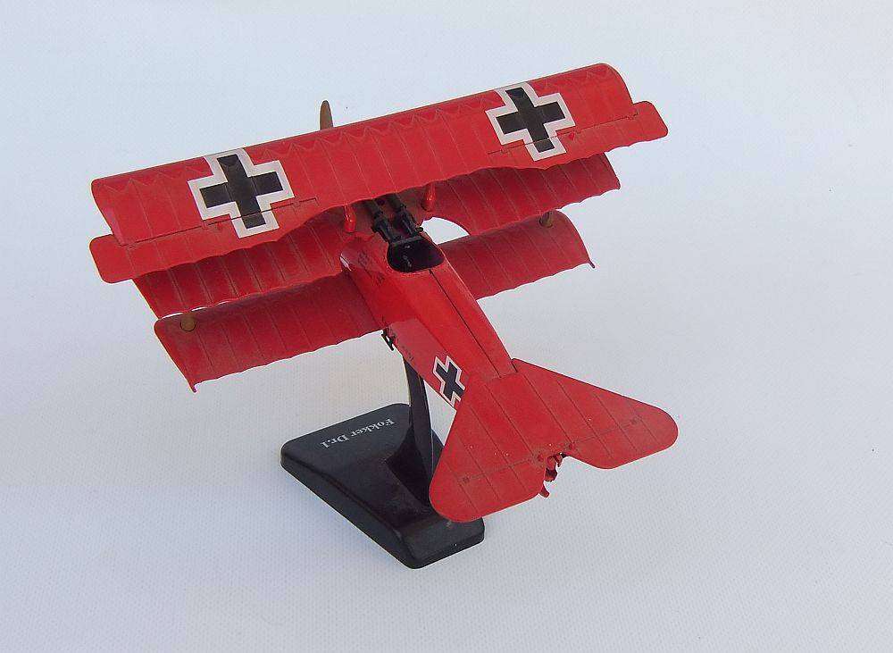 Three airplane models , two hardened plastic models by New Ray and a die cast metal model