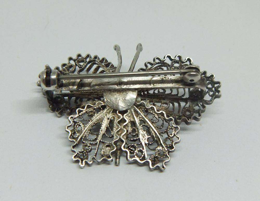 A vintage Egyptian 800 silver filigree butterfly brooch