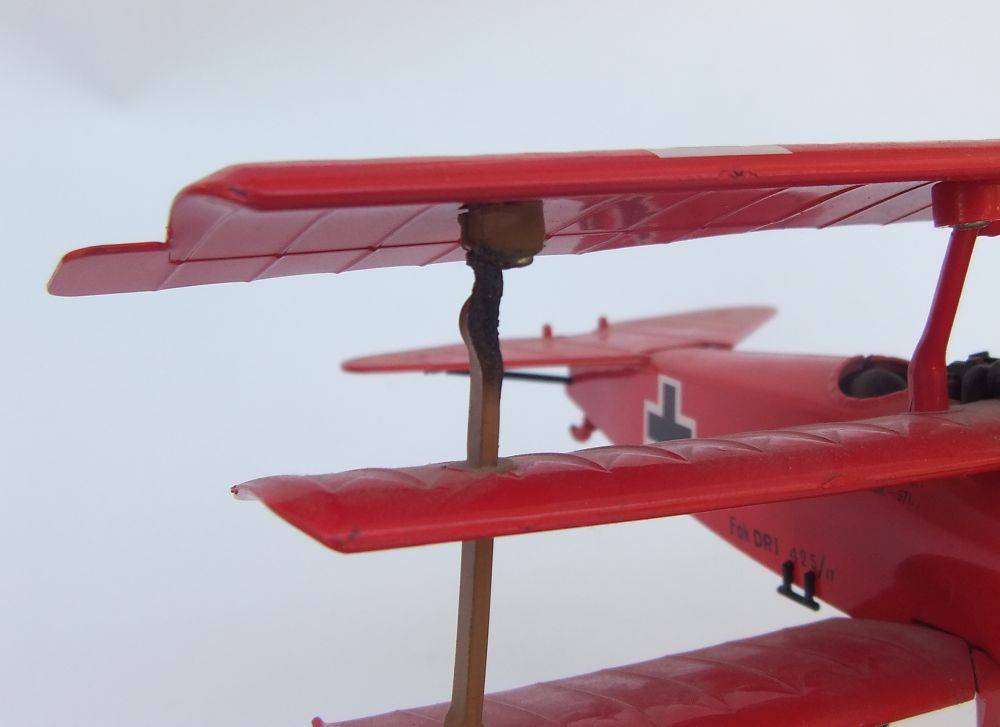 Three airplane models , two hardened plastic models by New Ray and a die cast metal model