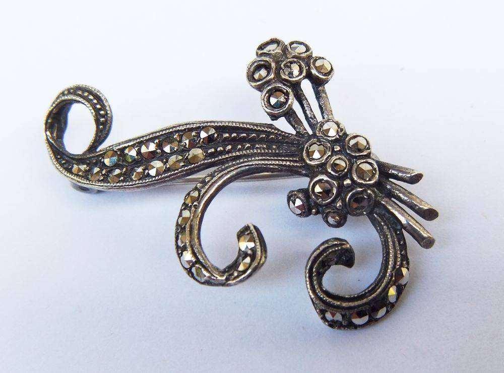 A vintage sterling silver brooch set with lots of marcasite