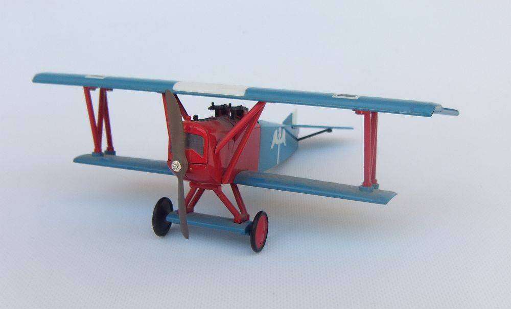 Three airplane models , two hardened plastic models by New Ray and a die cast metal model