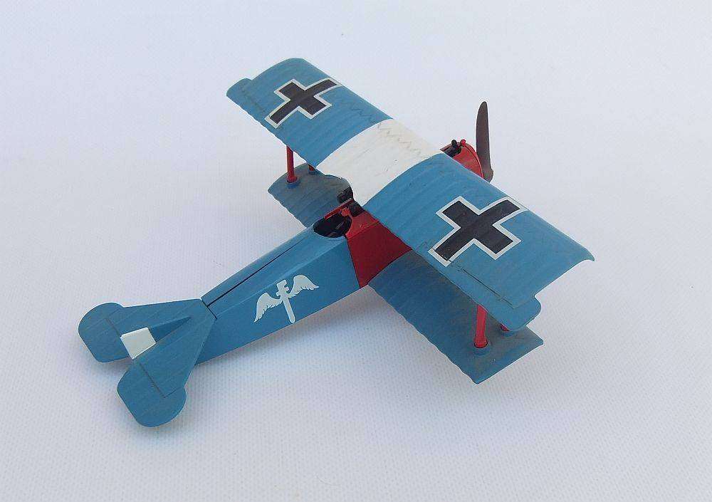 Three airplane models , two hardened plastic models by New Ray and a die cast metal model