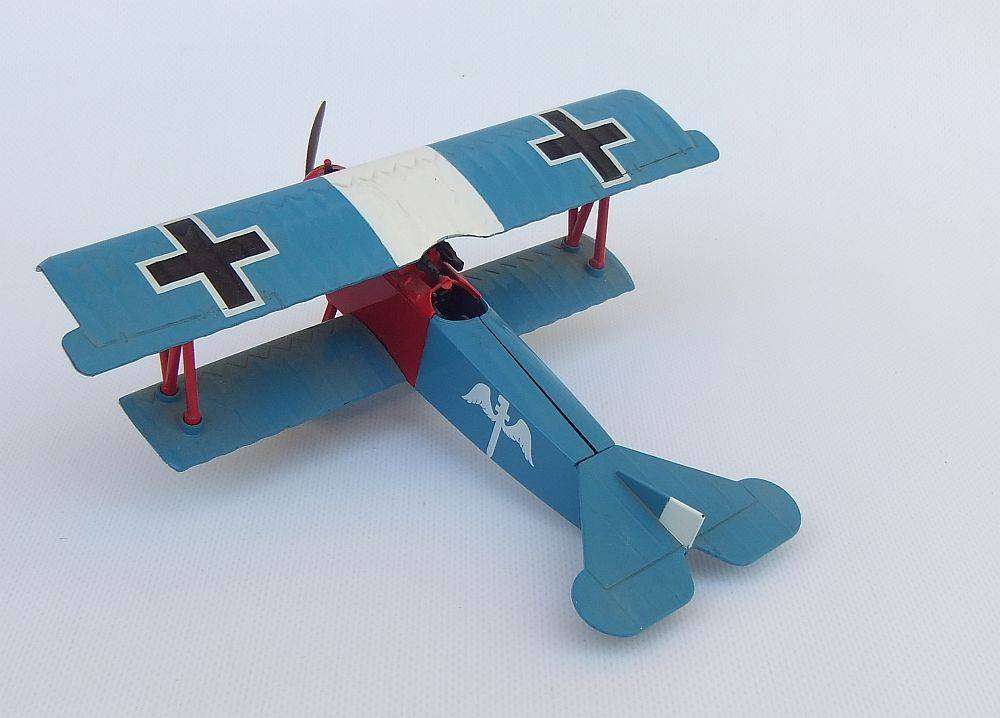 Three airplane models , two hardened plastic models by New Ray and a die cast metal model