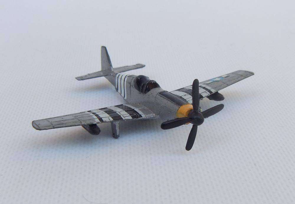 Three airplane models , two hardened plastic models by New Ray and a die cast metal model