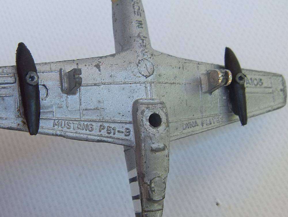 Three airplane models , two hardened plastic models by New Ray and a die cast metal model