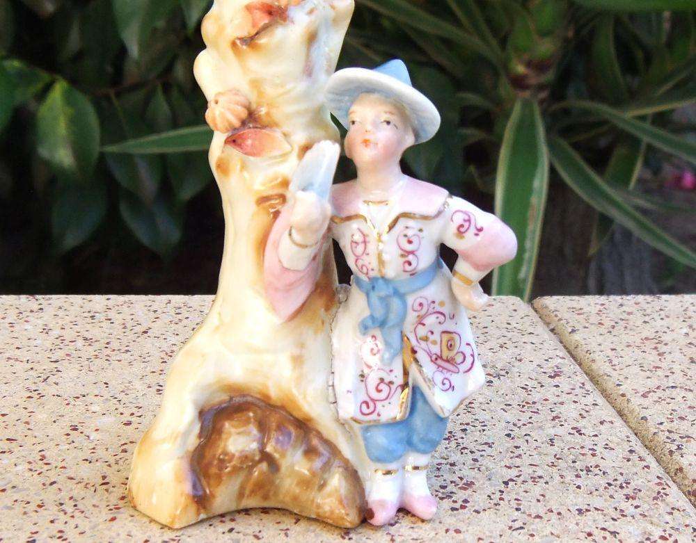 A rare Victorian era porcelain spill vase with Chinese man motif