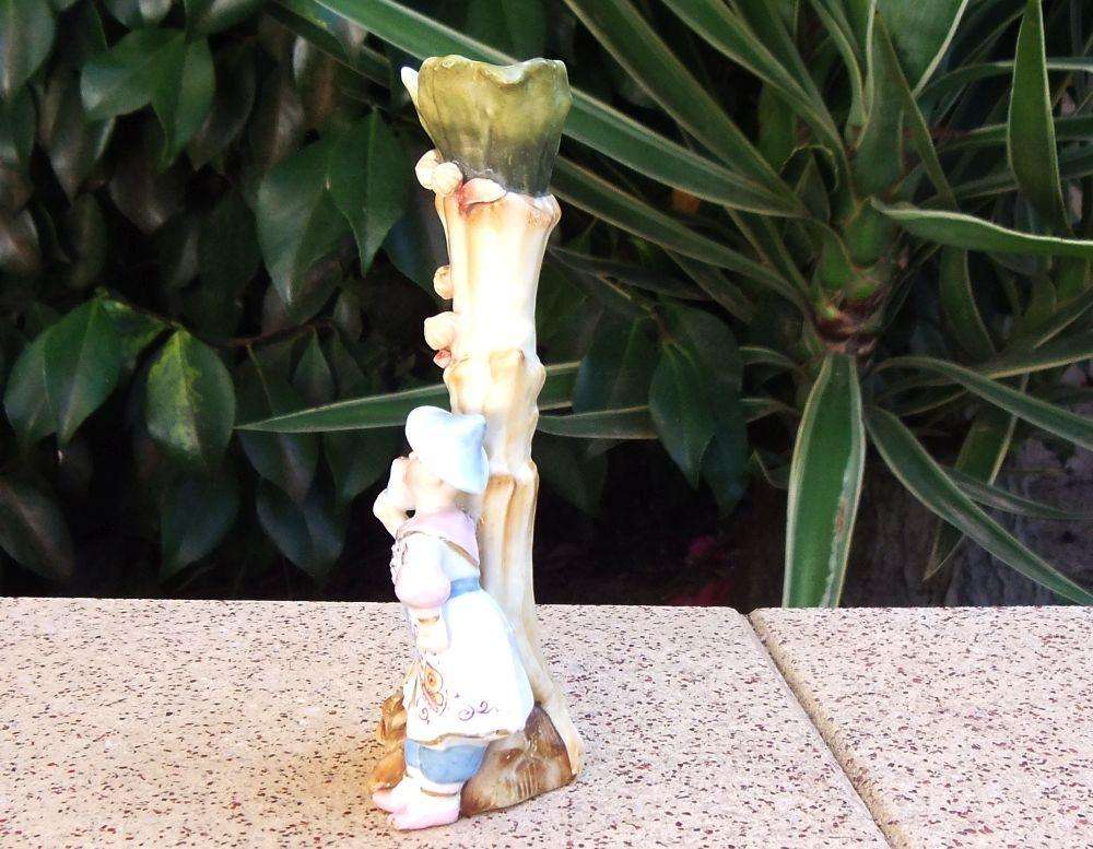 A rare Victorian era porcelain spill vase with Chinese man motif