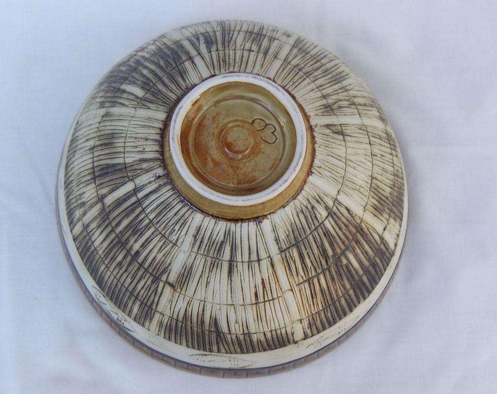 A large vintage hand made pottery fruit bowl with makers mark to base