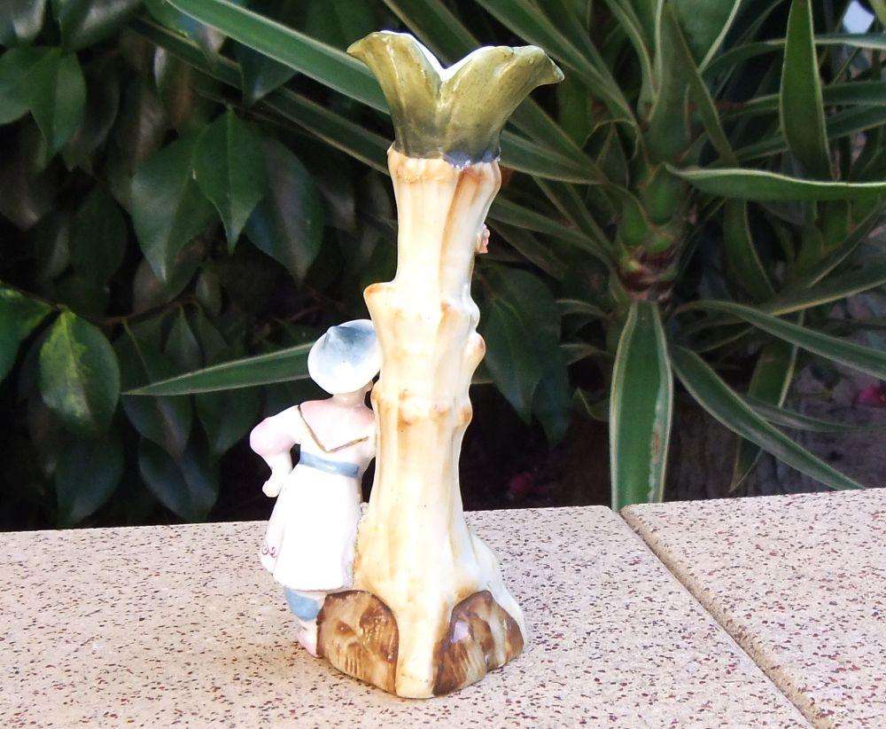 A rare Victorian era porcelain spill vase with Chinese man motif