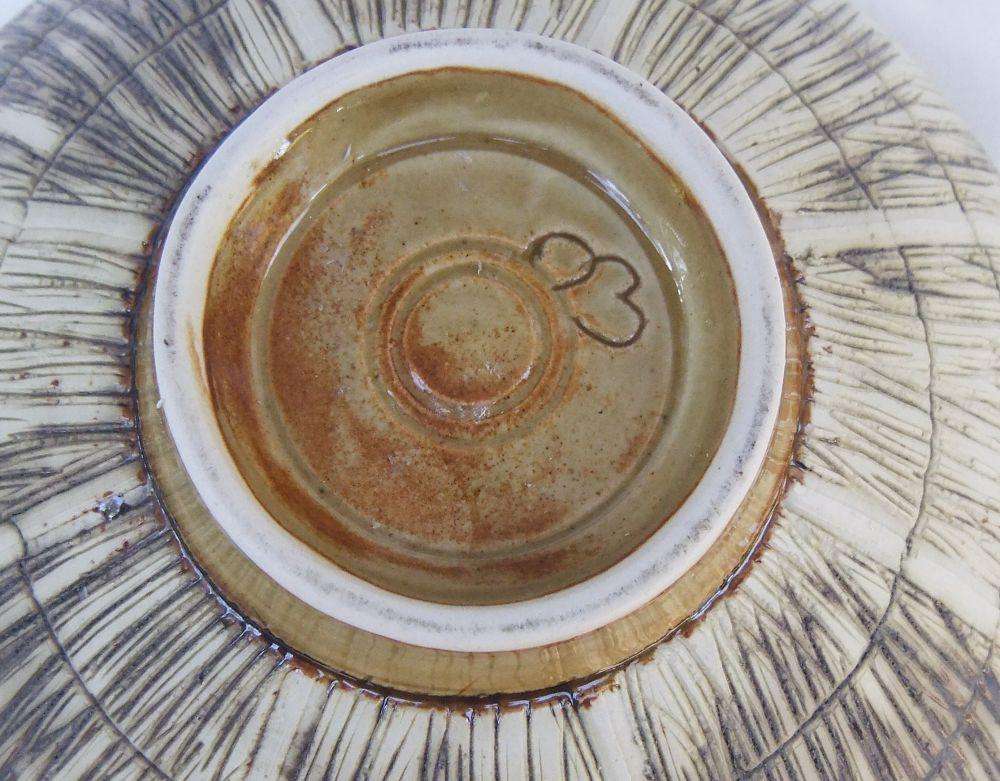 A large vintage hand made pottery fruit bowl with makers mark to base