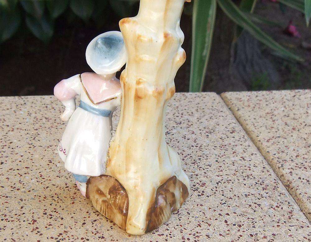 A rare Victorian era porcelain spill vase with Chinese man motif