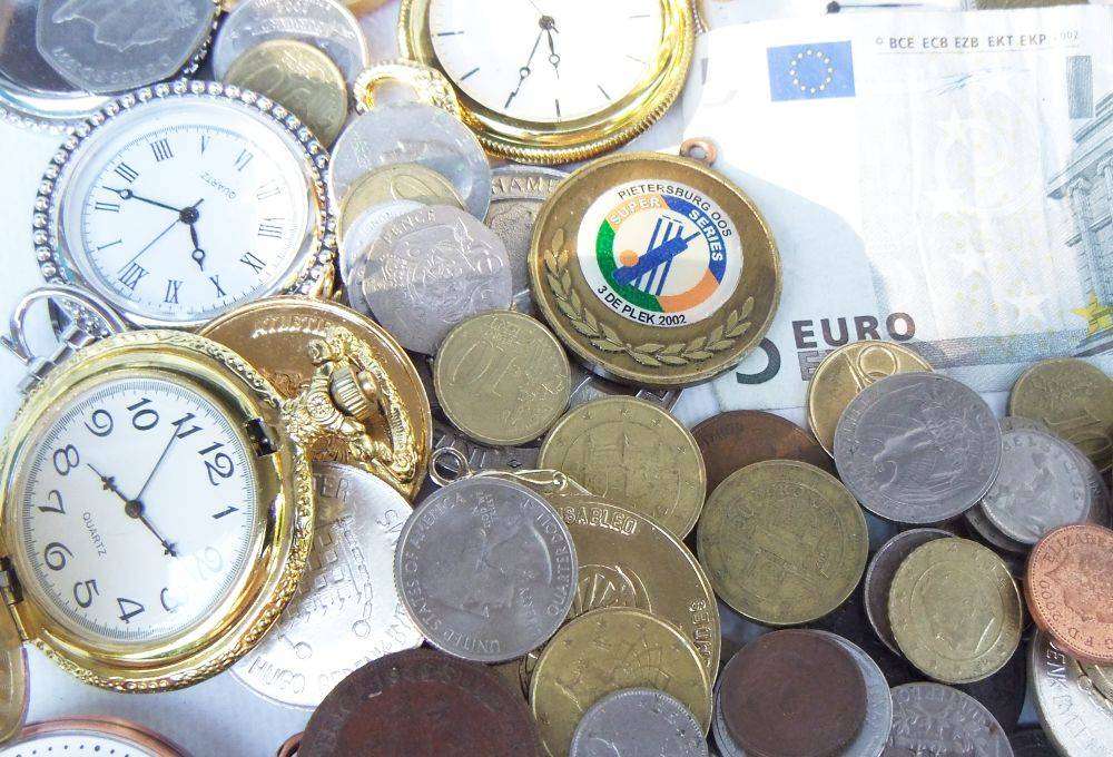 A bunch of medallions , over 100 world coins + 5 Euro note and allot of spare watch parts