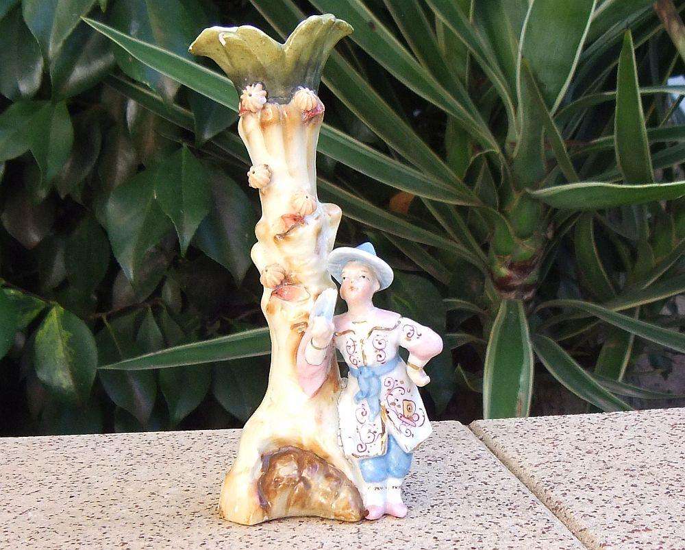 A rare Victorian era porcelain spill vase with Chinese man motif