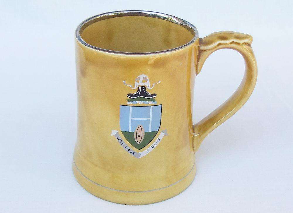 A vintage bar water jug with rugby theme made by Wade England