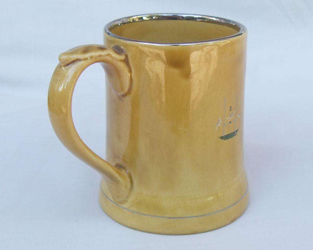 A vintage bar water jug with rugby theme made by Wade England