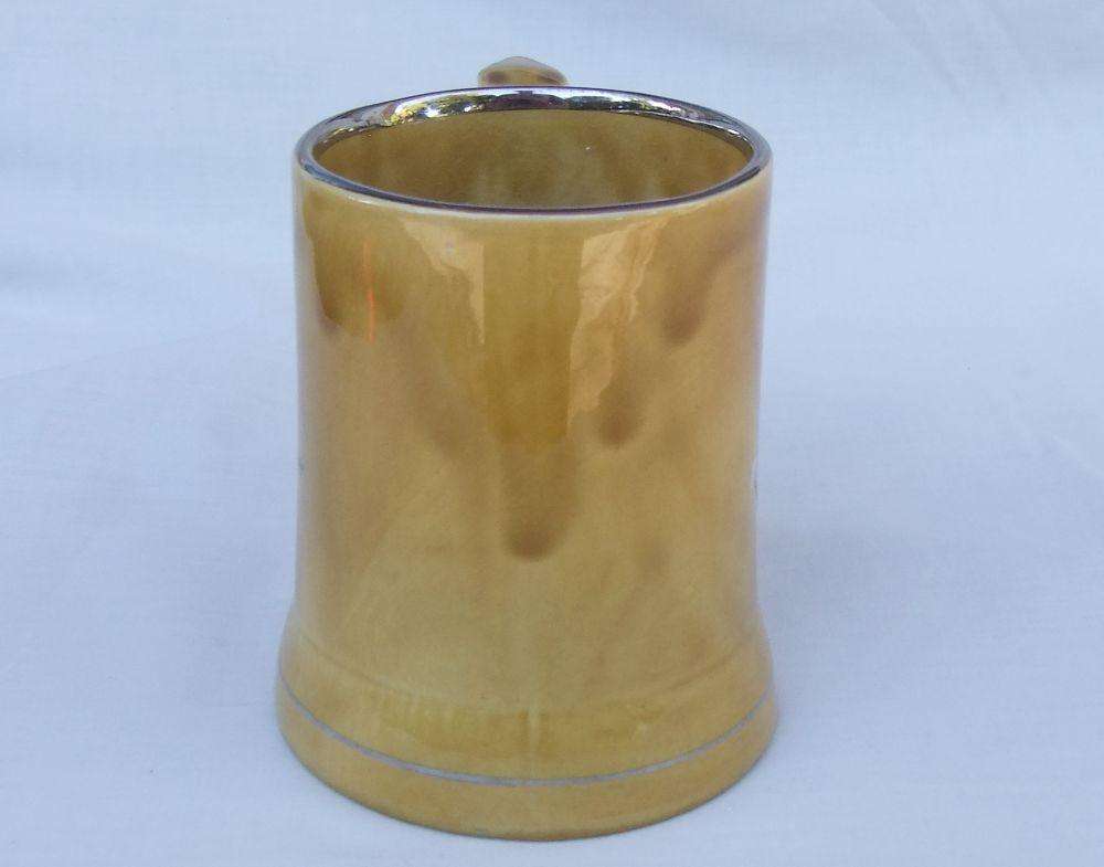 A vintage bar water jug with rugby theme made by Wade England