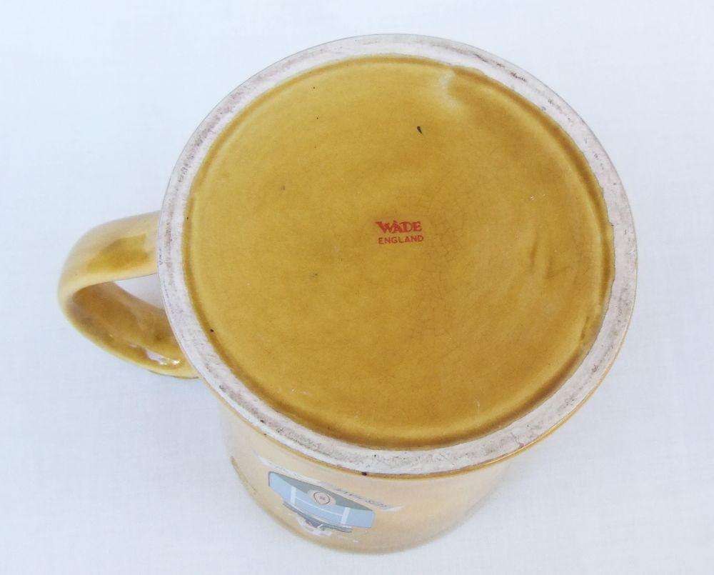 A vintage bar water jug with rugby theme made by Wade England