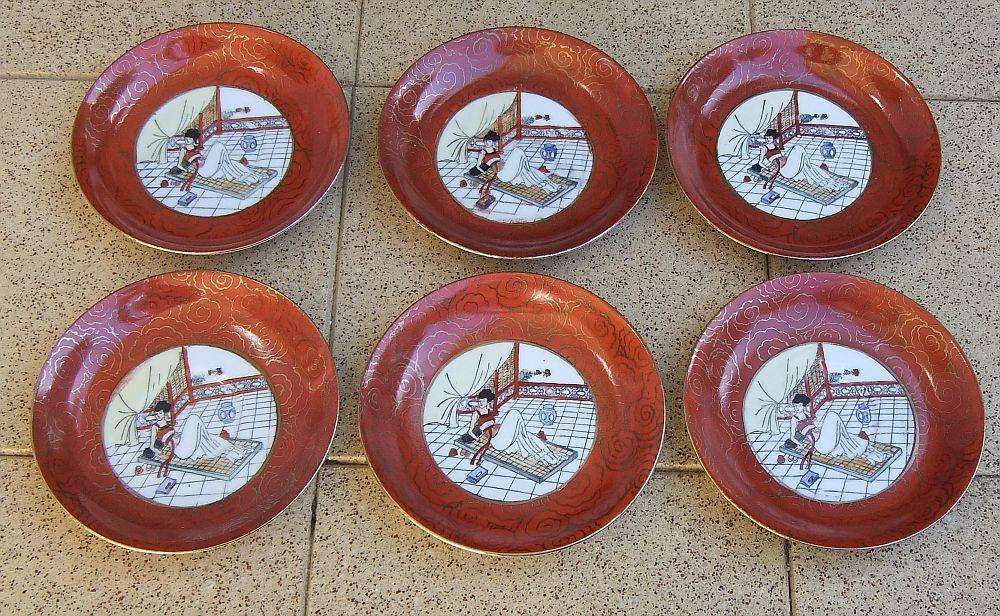 A set of six Japanese hand painted plates / saucers with makers mark