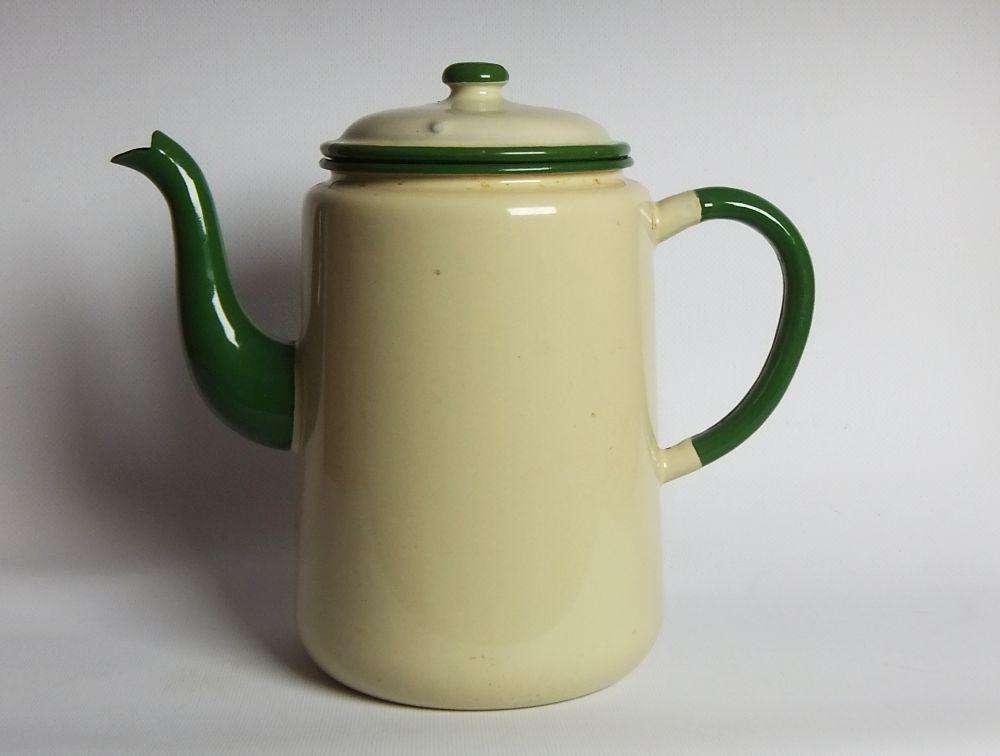 A vintage enamel camping tea or coffee pot