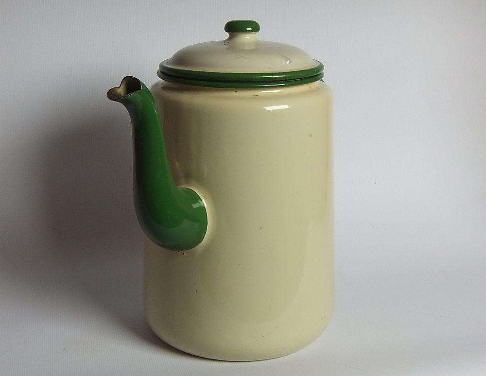A vintage enamel camping tea or coffee pot