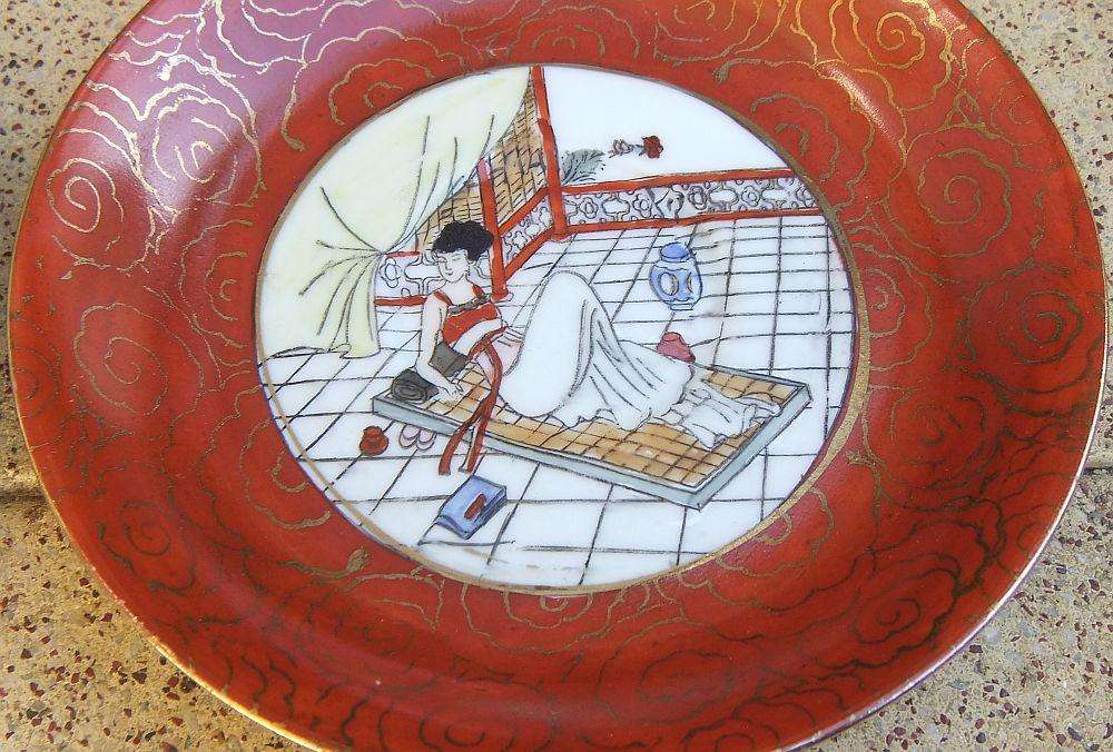 A set of six Japanese hand painted plates / saucers with makers mark