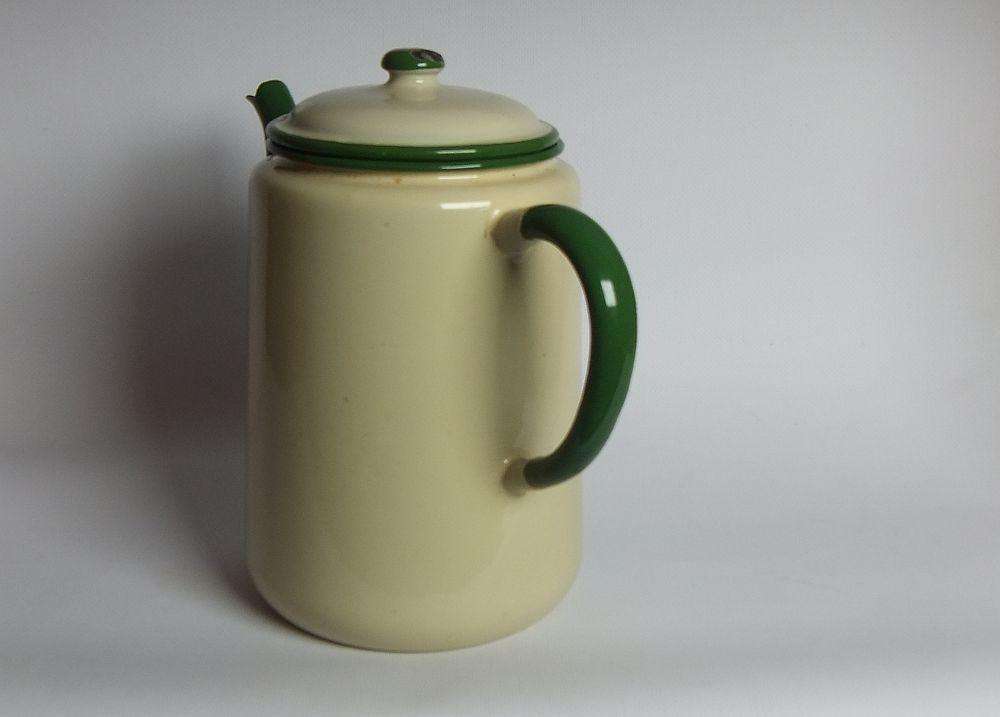 A vintage enamel camping tea or coffee pot