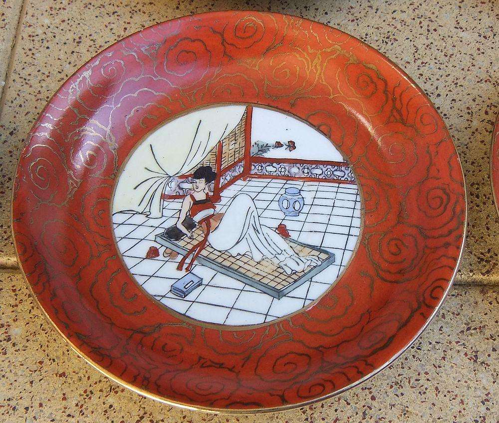 A set of six Japanese hand painted plates / saucers with makers mark