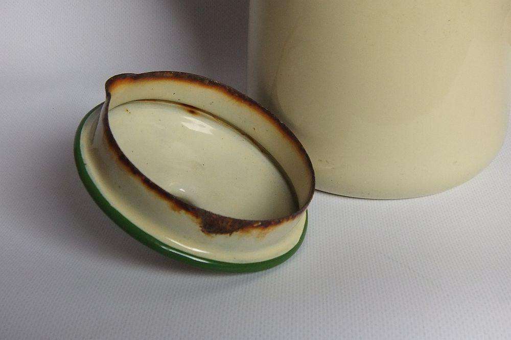 A vintage enamel camping tea or coffee pot