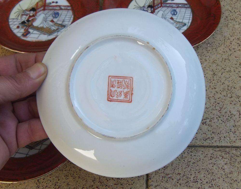 A set of six Japanese hand painted plates / saucers with makers mark