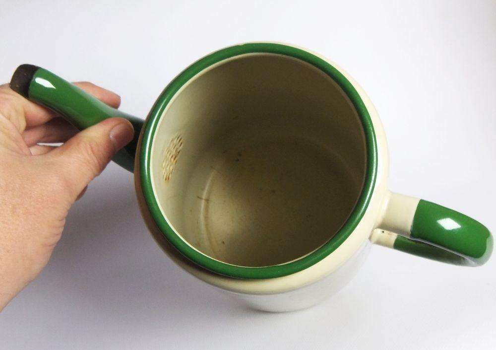 A vintage enamel camping tea or coffee pot