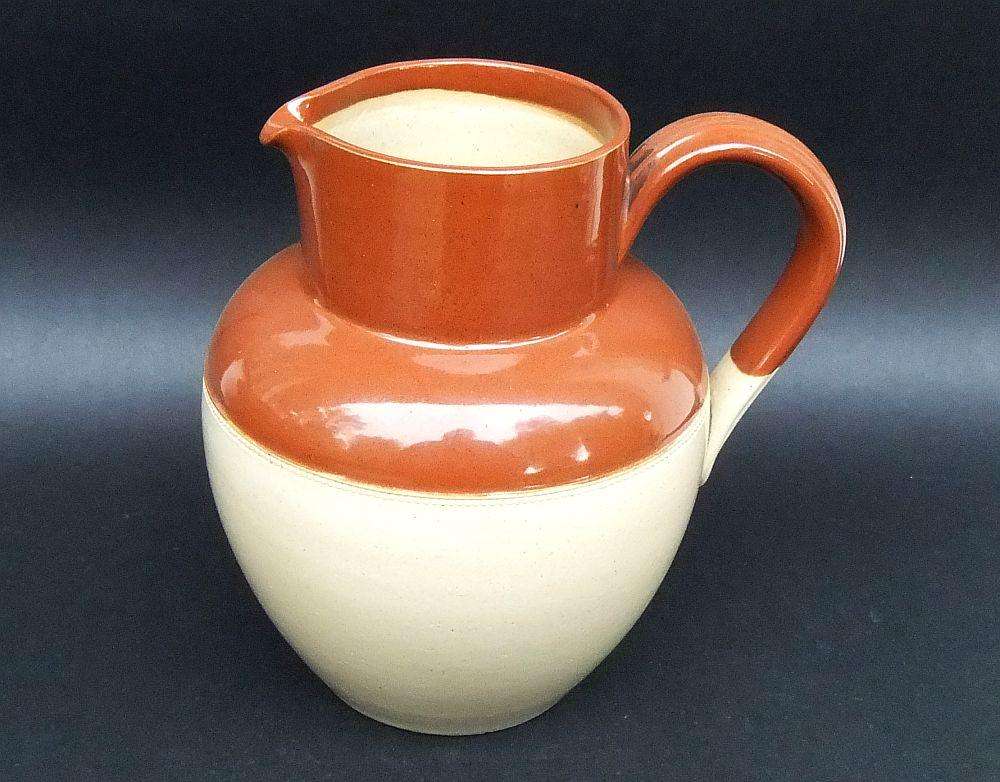 A vintage 1942 farmstyle milk or water ewer by Lovatts potteries
