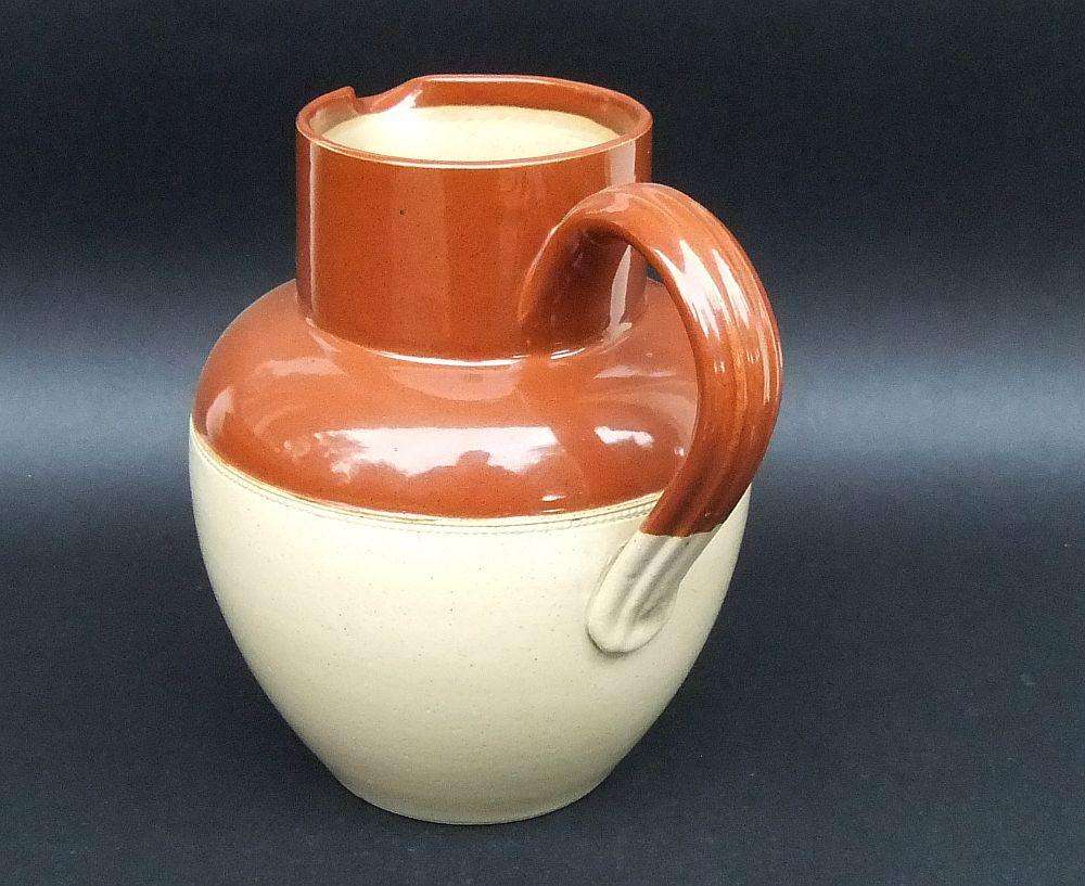 A vintage 1942 farmstyle milk or water ewer by Lovatts potteries