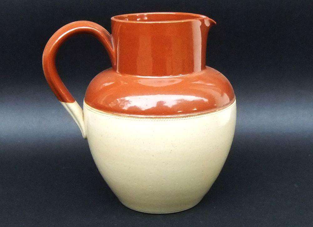 A vintage 1942 farmstyle milk or water ewer by Lovatts potteries