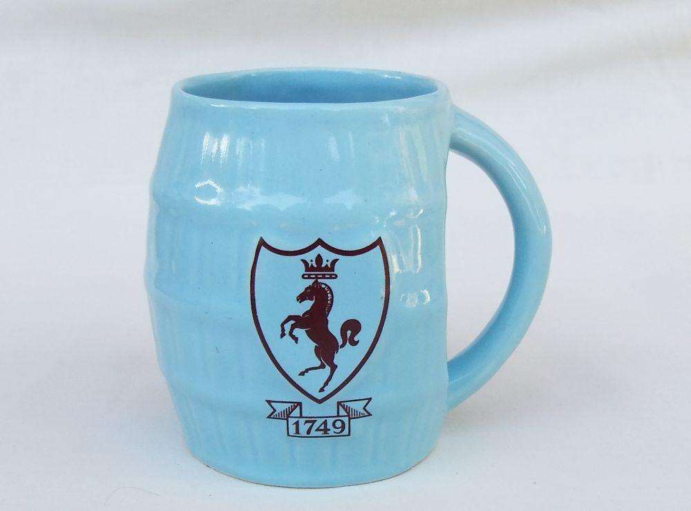 A vintage South African pottery mug with equestrian theme