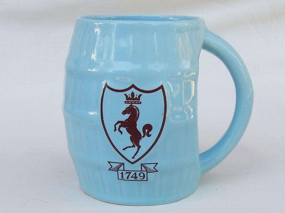 A vintage South African pottery mug with equestrian theme