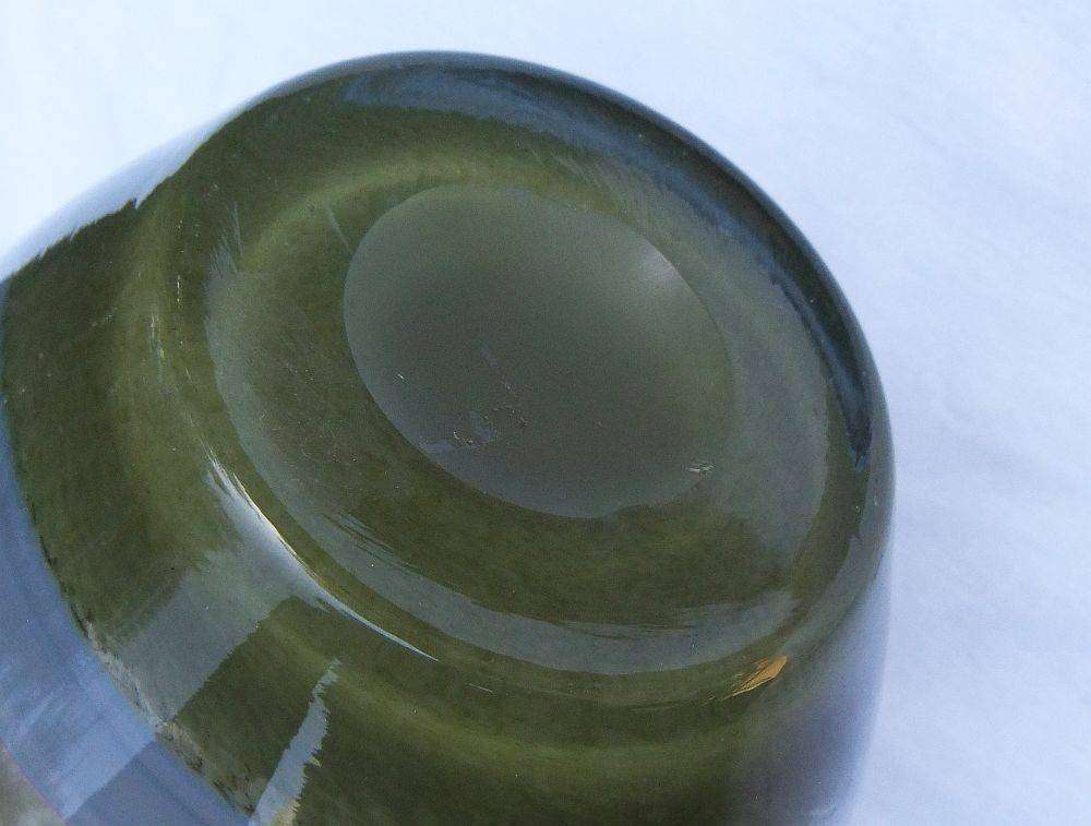 A tall , heavy for size and unique vintage art glass vase with interesting design