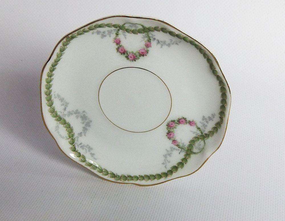 An early 20th centrury Bavarian porcelain duo in the Chrysantheme pattern , espresso sized