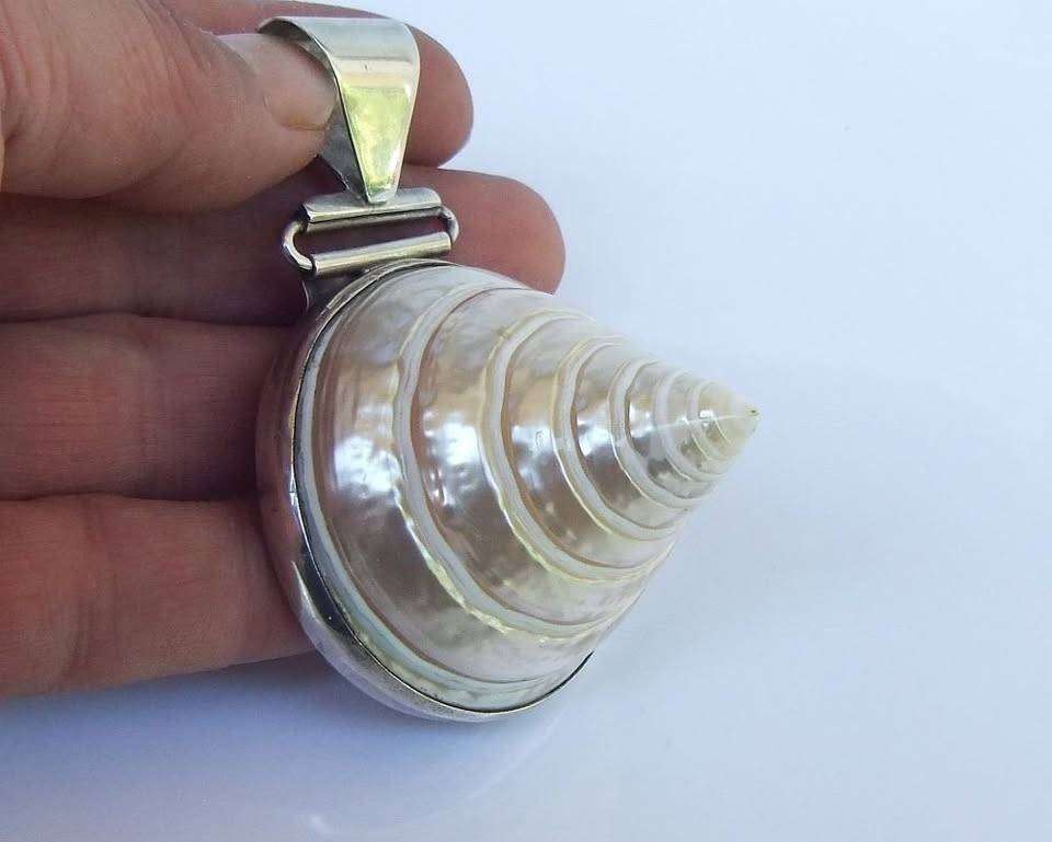 An exquisite unique Throchius Mother of Pearl pyramid top sea shell pendant set in sterling silver