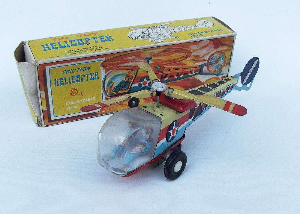 A very cool vintage Chinese lithograph friction powered tinplate helicopter with original box