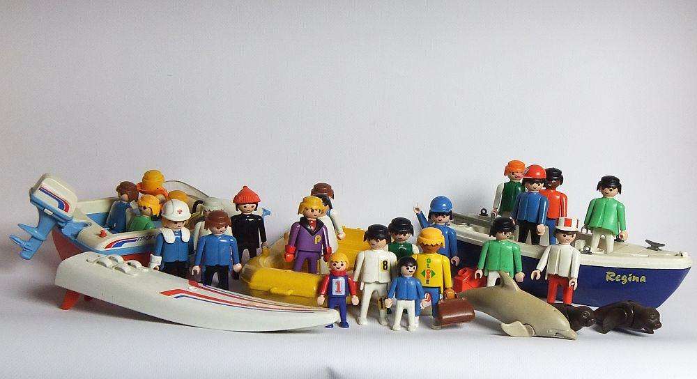 Thirty two pieces of vintage Playmobil toys including animals , boats and accessories