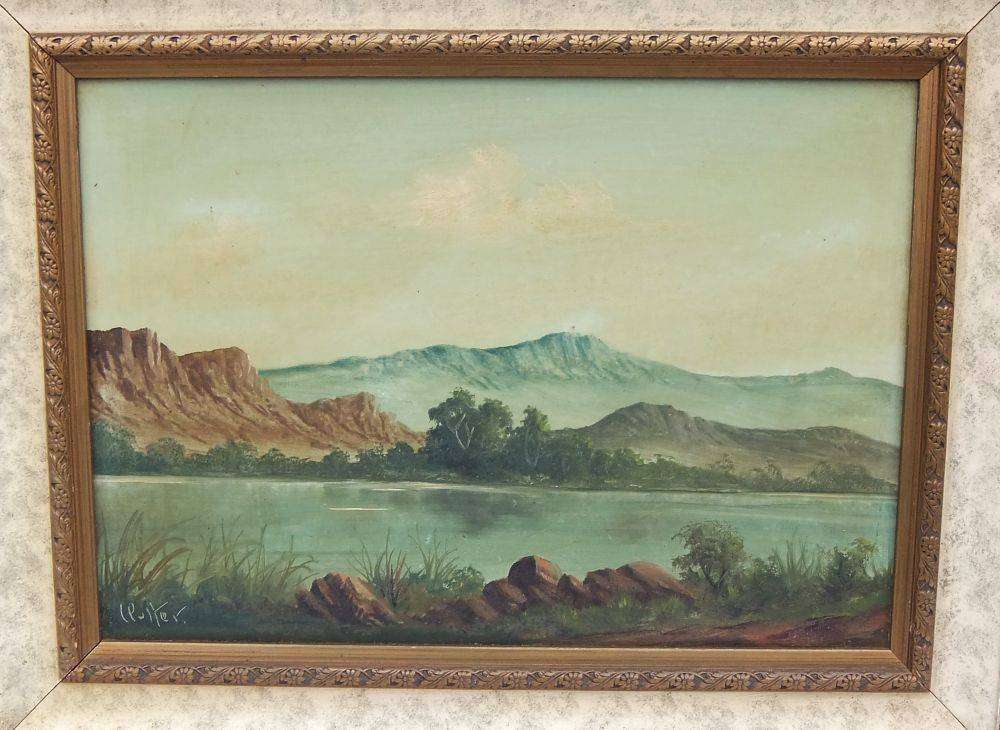 An original framed vintage oil painting depicting a lake scene signed by the artist