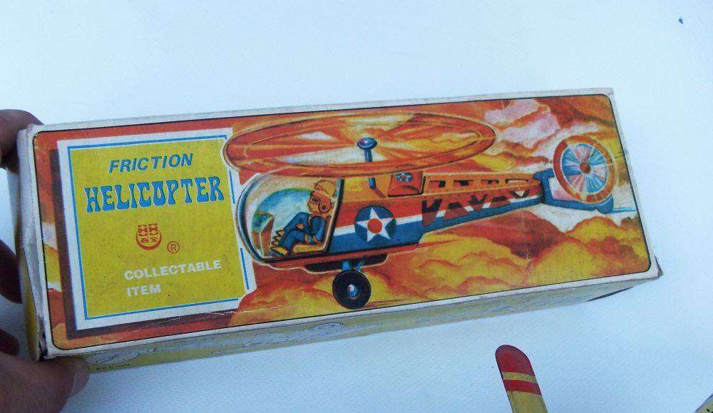 A very cool vintage Chinese lithograph friction powered tinplate helicopter with original box