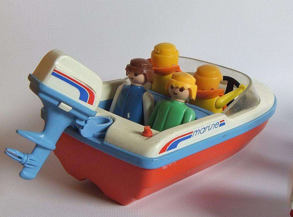 Thirty two pieces of vintage Playmobil toys including animals , boats and accessories