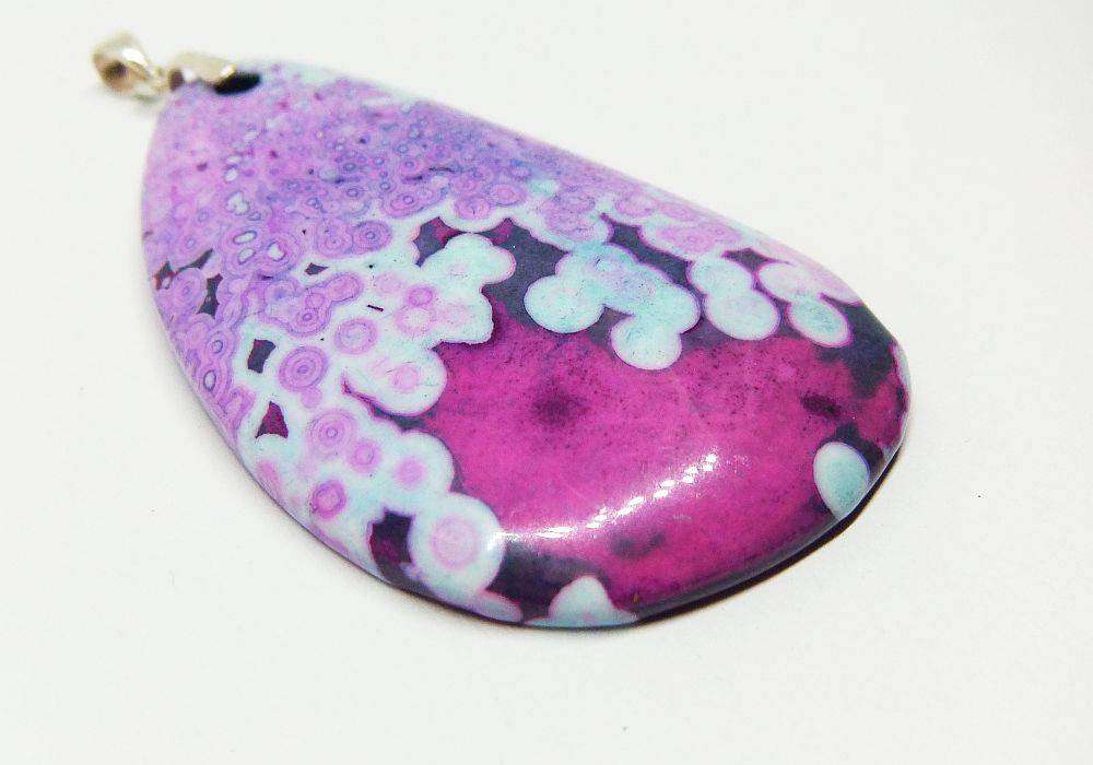 A stunning mystery pendant set with a sterling silver jump ring